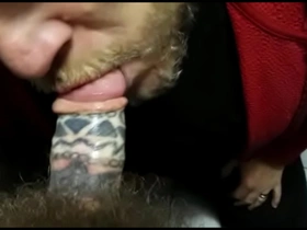 Sucking tattooed cock