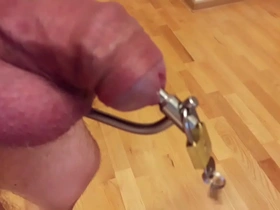 Male urethral chastity with small bullet plug inside first