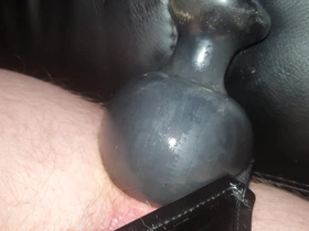 Pushing fully inflated buttplug out my ass