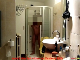 He is spied on playing with his huge cock in the bathroom
