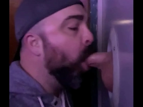 Sucking off stranger at the adult store gloryhole