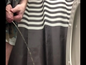 Uncut guy pissing and shaking out the drops